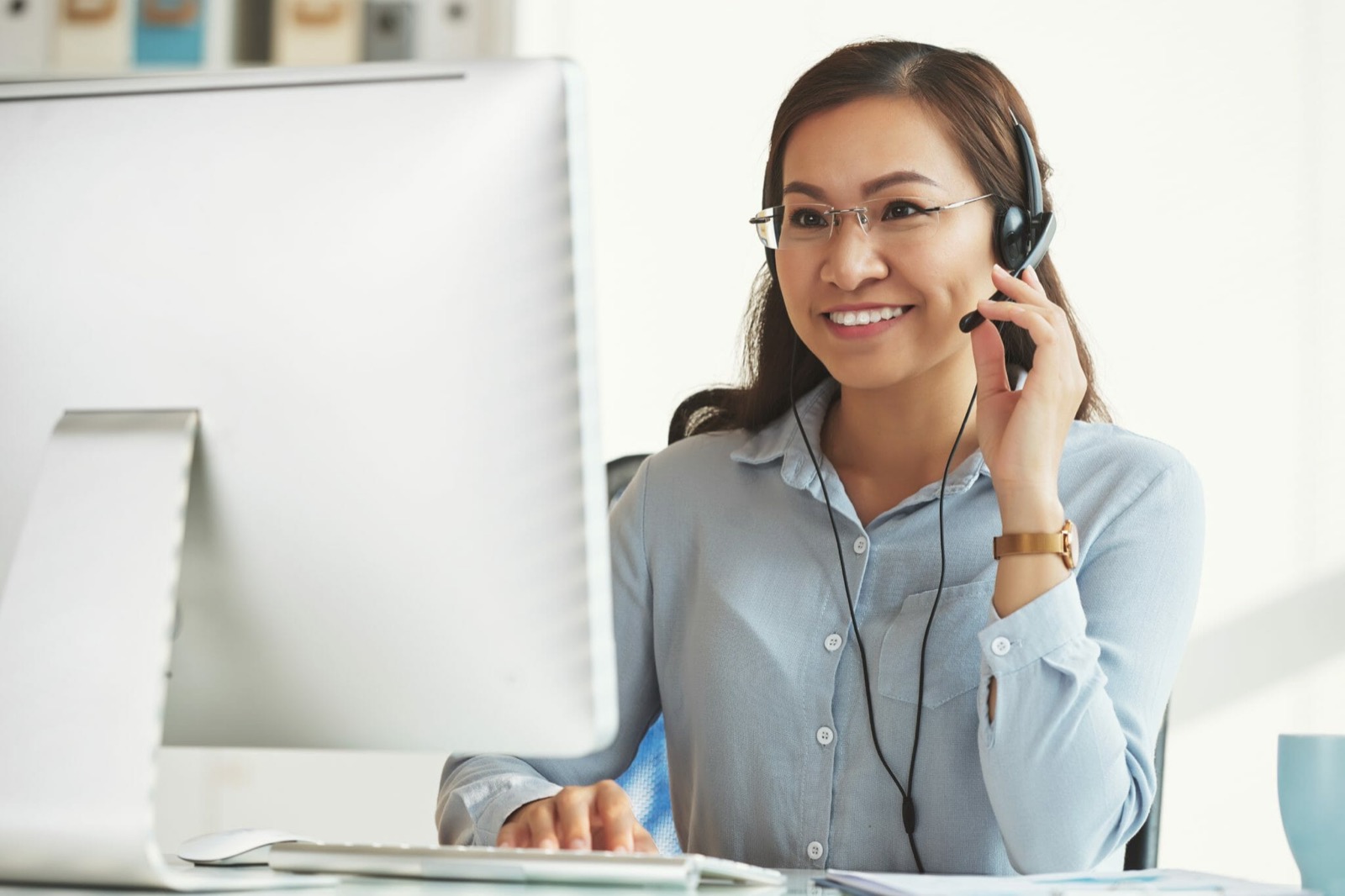 a remote assistant working at her computer as part of real estate BPO services