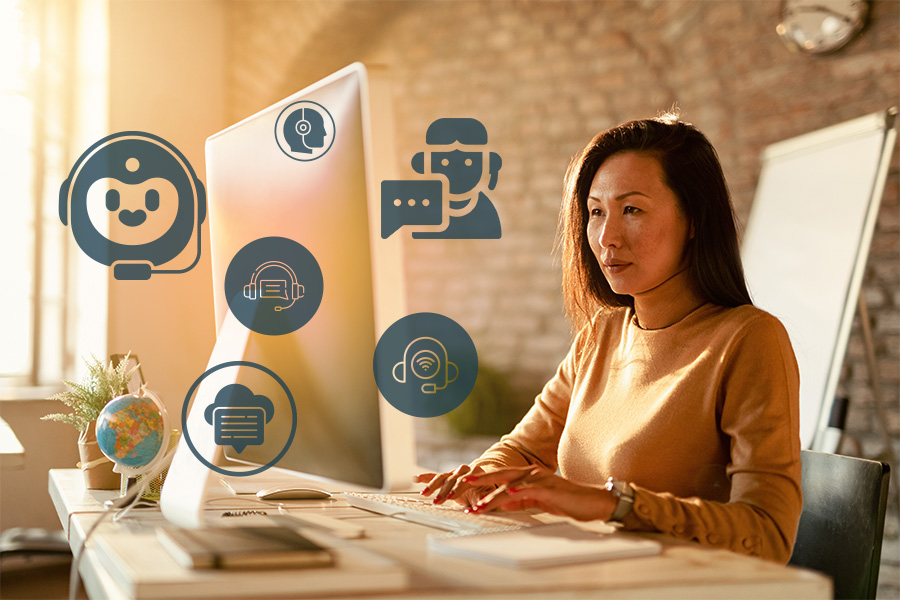 a female real estate virtual assistant seated at her desk viewing her computer screen with various task icons superimposed